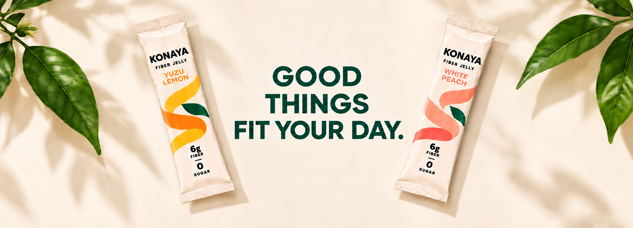 Good things fit your day. KONAYA Yuzu Lemon and White Peach sticks on an ivory background with leaves and soft shadows.